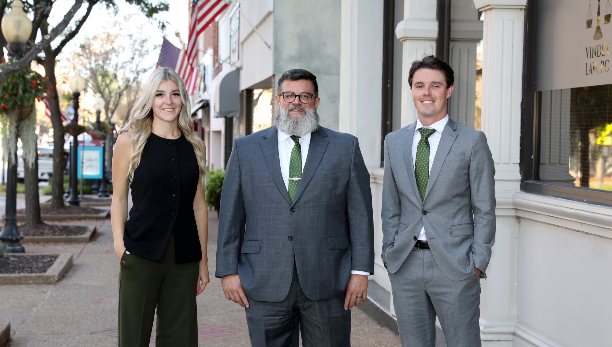 The attorneys and staff of Vindex Law, PC outside the firm's office in downtown Jefferson City, Missouri
